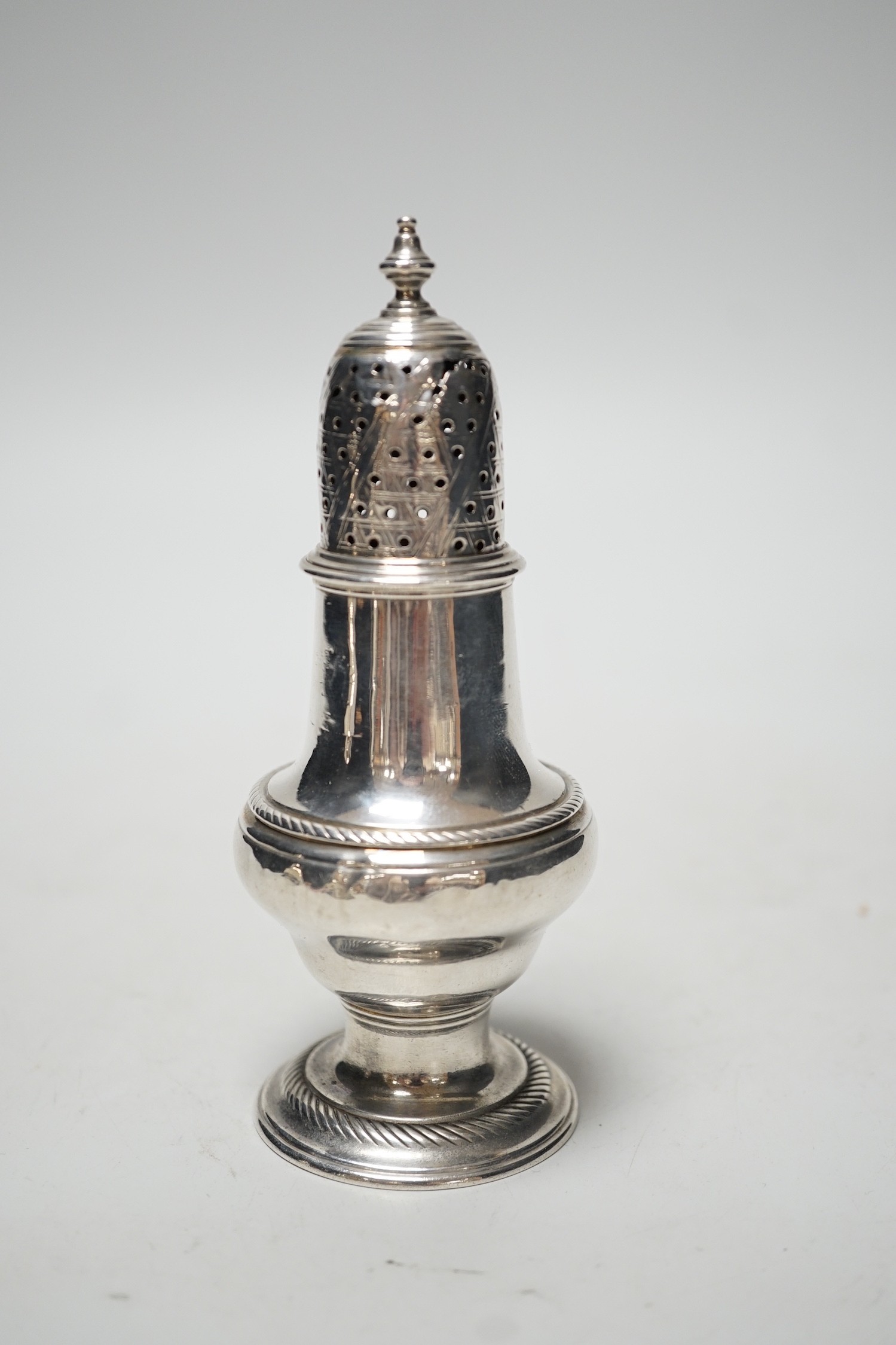 A George II silver baluster pepperette, John Delmester, London, 1757?, 13.1cm, 94 grams.